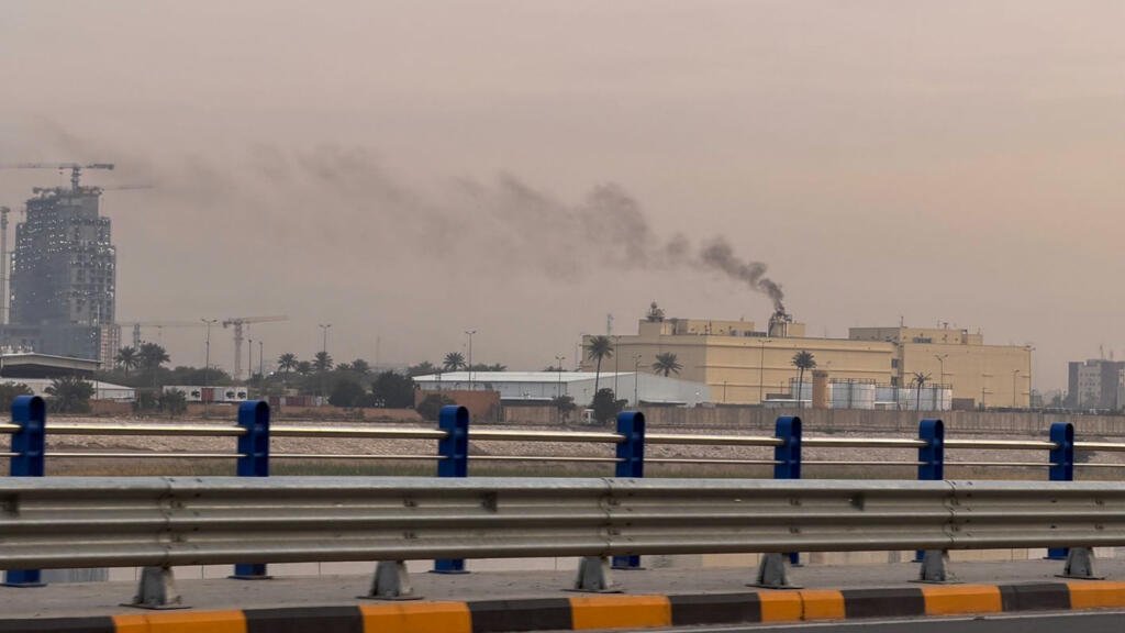 Smoke rises from the US embassy building in Baghdad