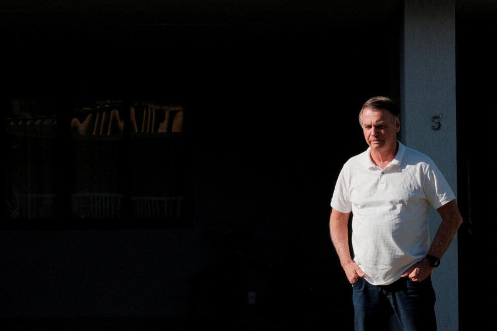 Brazil's former President Jair Bolsonaro looks on from his home in Brasilia, Brazil, on September 29, 2025