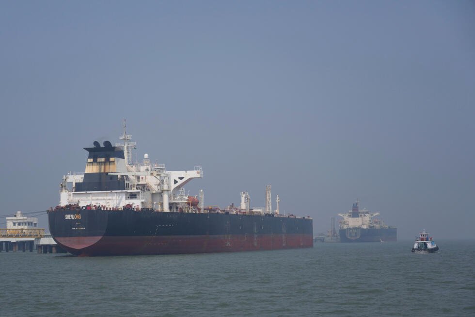Liberia-flagged tanker Shenlong Suezmax, carrying crude oil from Saudi Arabia, that arrived clearing the Strait of Hormuz, is seen at the Mumbai Port in Mumbai, India, on March 12, 2026